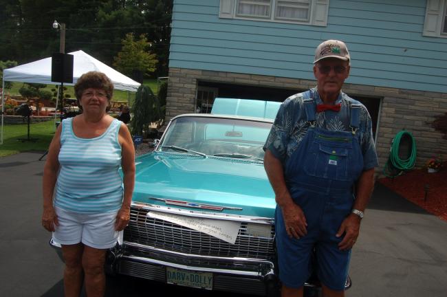 TERRY AHNER/TIMES NEWS Dolly and Darwin Strohl, of Lehighton, pose in front of their 1963 Impala Super Sport 50 years after they purchased it new from the former Jack Dankel Chevrolet in Allentown. The celebration was held in conjunction with the…