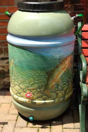 LINDA KOEHLER/TIMES NEWS This rainbarrel, "About to Rise" was painted by Don Baylor and is located at Dunkleberger's on Main St., Stroudsburg.