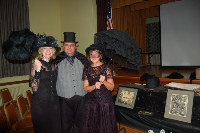 LINDA KOEHLER/TIMES NEWS Concourse Club of Palmerton members, left, Christine Campbell and Barbara Hafer-Prout, right, came dressed for a Victorian funeral at the October meeting. "Undertaker" Dale Freudenberger, president of the Tamaqua Historical…