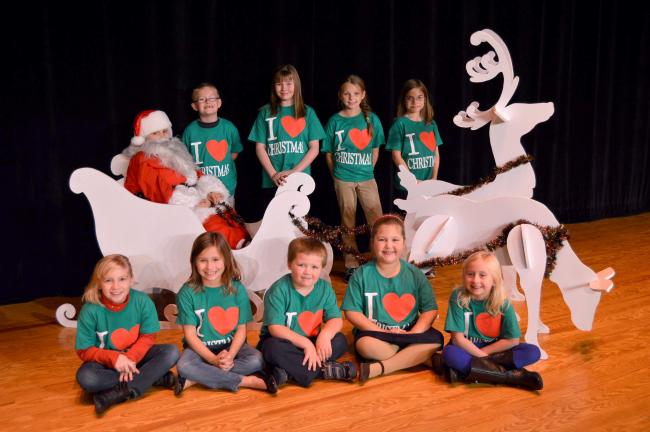 KAREN CIMMS/TIMES NEWS Some of the cast members for "I Love Christmas" include, seated, from left, Lillian Heydt, Erin Remmel, Cole Harwood, Brinn Harwood and Willa Bartholomew. Second row, Jordan Remmel (Santa), Brayden Harleman, Brooke McElmoyle,…