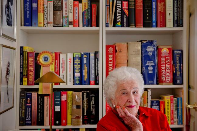 Longtime crossword constructor Bernice Gordon born on Jan. 11, 1914, poses for a portrait with her dictionaries at her home, Tuesday, Dec. 31, 2013, in Philadelphia. The New York Times is scheduled publish one of her puzzles, making her the first…