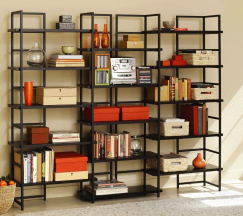 AP Photo This photo provided by AllModern.com shows a TFG Connections Bookcase, an open-backed modern bookcase that can be used to divide rooms or set the perimeter of a library-focused space. Contemporary home libraries utilize room for books or…