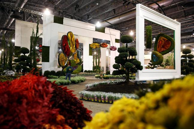 Work is conducted on the entrance garden in preparation for the annual Philadelphia Flower Show at the Pennsylvania Convention Center, Thursday, Feb. 27, 2014, in Philadelphia. The garden is inspired by the paintings and sculptures of Alexander Â…
