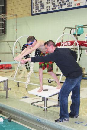 LIZ PINKEY/SPECIAL TO THE TIMES NEWSCoach "Wink" Kovalchick instructs swimmer Anthony Witczak on the finer points of diving.
