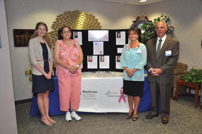 AMY MILLER/TIMES NEWS Gallery of Hope recipients Jane Longazel, second from left, and Susan Generose, second from right, open the 14th annual Blue Cross of Northeastern Pennsylvania Gallery of Hope exhibit at Blue Mountain Health System's Gnaden…