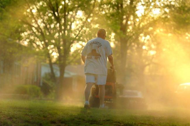 FILE - In a Monday, April 5, 2010, file photo, Shane Nantz kicks up a cloud of pollen as he mows the front yard of his west Charlotte, N.C., home. Seasonal allergy sufferers can try newly FDA-approved types of immnotherapy, once-a-day tablets…