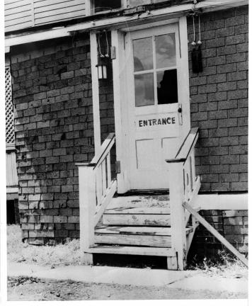 (ACME) COURTESY TAMAQUA HISTORICAL SOCIETY Bullet holes and broken glass in the Amber Lantern's side door attest to the violence on Flag Day 1938.