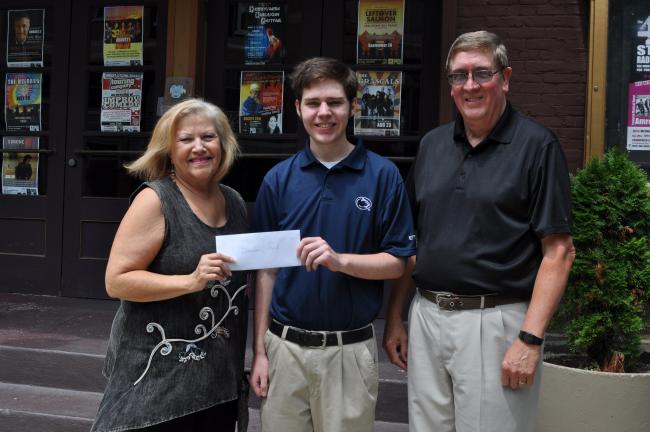 Helen Van Pelt, president of the Mauch Chunk Historical Society, and Bob Stevenson, vice president of the Mauch Chunk Museum and Cultural Center, present a $500 scholarship to Bronson Ford.