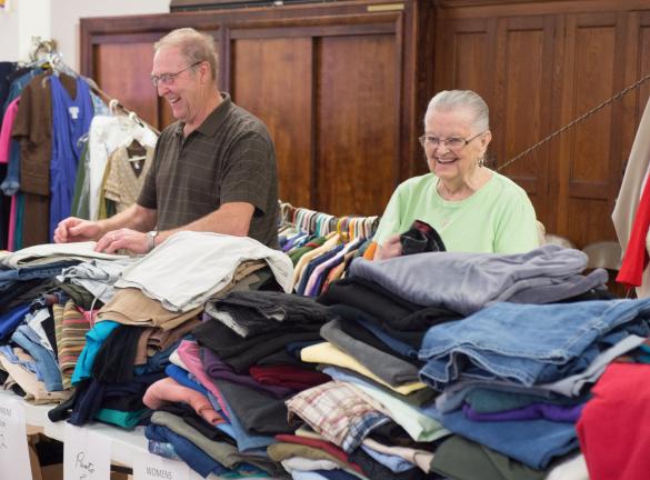 Luther Snyder and Miriam Borosh laugh as they go through donated clothing at St. Johns Lutheran church in the heights section of Jim Thorpe.