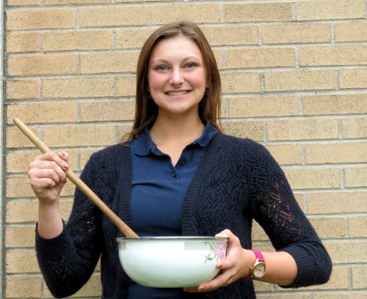 DONALD R. SERFASS/TIMES NEWS Madelyn Dolinsky, Tamaqua, demonstrates how she mixes together peanut butter and chopped peanuts to create a recipe that grabbed the attention of the Turkey Hill chain and earned her finalist status in competition.