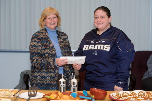 @$:AMY MILLER/TIMES NEWS  Times News Editor in Chief Marta Gouger congratulates grand prize winner Jennifer Domines.