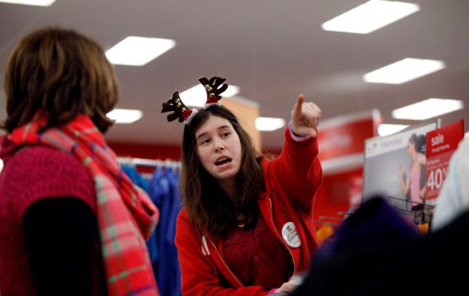 AP Photo/Robert F. Bukaty In this November 2014 photo, employee Jen Sans points a customer in the right direction at a Target store, in South Portland, Maine. The National Retail  Federation found in a survey that only 9 percent of shoppers finished…