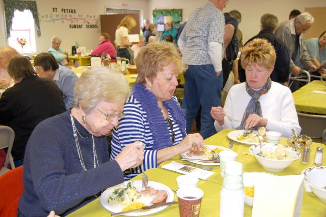 ELSA KERSCHNER/TIMES NEWS Paulette Bassler, Carolyn Zwetolitz and Sandi Cleaver look forward to the meal they are just starting to eat.