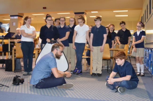 Professional photographer Jordan Flexer prepares to provide a demonstration on the use of filters and props during his presentation. For a photo gallery, see tnonline.com. KATHY KUNKEL/TIMES NEWS