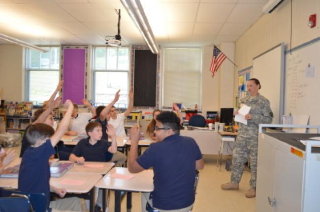 Army Staff Sgt. Amanda Kerr speaks to Tamaqua Area Middle School students as part of the school's Career Day on Friday. She told the students the hardest part of being in the military is being away from family, but added it's worth it.