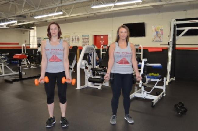 Circuit 1: Bicep curls, using a 5- to 10-pound weight. Stand with your arms straight in front of you, wrists out.