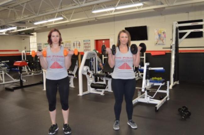 Raise your arms, then lower them back in front of you. Repeat 20 times.