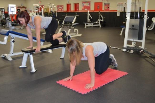 Circuit 3: Donkey kicks. Position yourself on the floor or on an exercise bench, with your arms straight and knees on the floor.