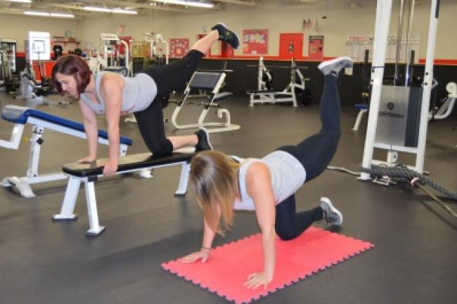 Push your leg back and up. Repeat 20 times on each side.