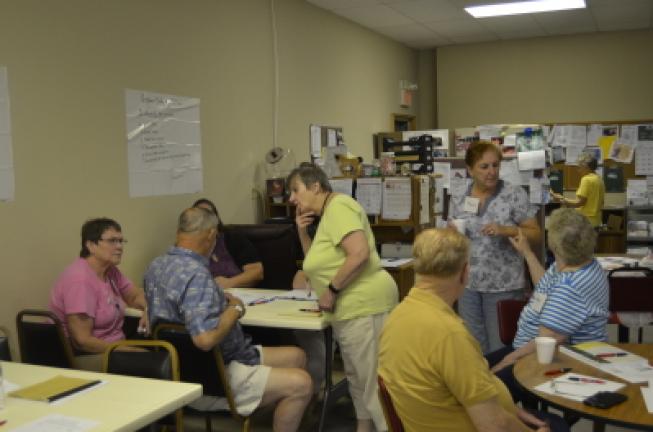 Participants talk in groups about how to make the best meal for a diabetic diet at the Penn Kidder Center in Jim Thorpe Friday. BENJAMIN WINN/TIMES NEWS
