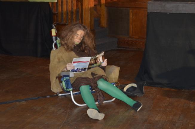 The Troll, played by Ashley Beers, lounges as a sight gag. BENJAMIN WINN/TIMES NEWS