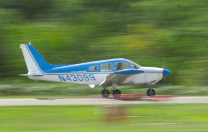 Elena Beckett, 16, of Mahoning Valley lands a Piper Cherokee Archer after the third landing of her solo flight day.