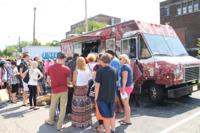 Hundreds of VegFest attendees lined up for The Cinnamon Snail food cart, which featured unique vegan sandwiches and desserts. BRIAN W. MYSZKOWSKI/TIMES NEWS