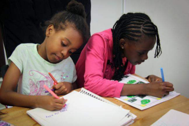 This June 2017 photo provided by Writopia Lab shows Leila Cisse, left, and Nyla Blake-Sodden taking part in a Writopia Lab in New York. Writopia's mission is to use creative writing to foster "joy, literacy, and critical thinking in children and…