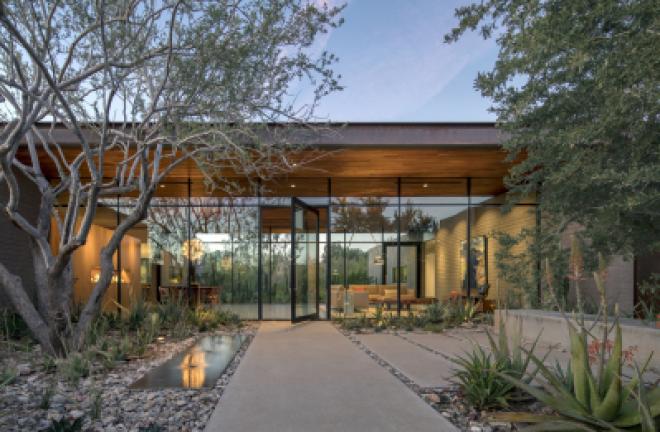 This photo provided by Weddle Gilmore black rock studio shows the entry courtyard of a residence located in Paradise Valley, Ariz. (Bill Timmerman/Weddle Gilmore via AP)