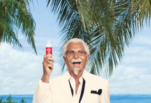 This undated photo provided by KFC shows an image from an ad campaign featuring actor George Hamilton portraying Colonel Sanders, as he holds a bottle of Extra Crispy Sunscreen. On Monday, Aug. 22, 2016, KFC gave away 3,000 bottles of fried-chicken…
