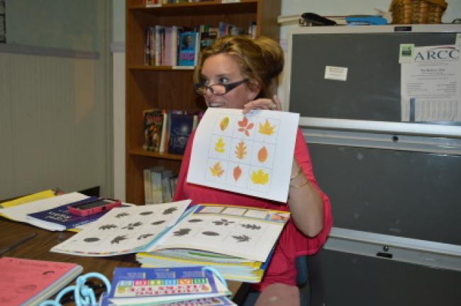 Tracy Geist demonstrates a matching game during her speech seminar Monday at Care Net. KELLEY ANDRADE/TIMES NEWS