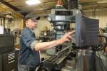 James Bretz uses a manual milling machine at BTM Inc. STACEY SOLT/CONTRIBUTED TO THE TIMES NEWS