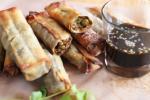 Baked Egg Rolls with Sesame-soy Dipping Sauce are a lighter alternative to the typical fried version. AP PHOTO/MATTHEW MEAD