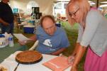Paul Myers, left, and Susan Asmann judge an apple pie Sunday at the Carbon County Fair, which opened Monday. Scan this photo with the Prindeo app to see a video from the judging. KAREN CIMMS/TIMES NEWS