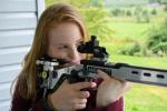 Sarah Frantz, 15, of Andreas, shows how to hold a smallbore rifle.