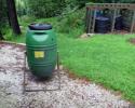 A barrel composter near Eileen East's garden.