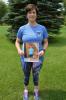 April Treible of Lehighton holds a photo of herself before she lost 30 pounds. KAREN CIMMS/TIMES NEWS There should be a photo of April standing outside holding a "before" photo of herself, and one of all her ribbons, which isn't really necessary....