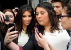 Kim Kardashian, left, is surrounded by her fans who are attempting to have their photographs taken with her In Melbourne, Australia. AP FILE PHOTO