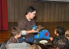 VICTOR IZZO/SPECIAL TO THE TIMES NEWS Jeannie Carl, a Naturalist at the Carbon County Environmental Education Center (CCEEC) speaks to the gathered children about "Dent", a 41 year old Eastern Box Turtle during "Family Fun Night" last Thursday…