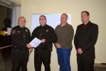 RON GOWER/TIMES NEWS Lansford part-time police officer Tom Fort, second from left, receives letter of commedation from Chief of Police John Turkmanovich, left, during meeting of Lansford Borough Council last night. Looking on are Ron Hood, second…