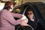 CHRIS PARKER/TIMES NEWS Blue Mountain Health System nurse Stacy Sheckler gives a seasonal flu shot to Ann Honzo of Palmerton at the Lehighton Fire Company Thursday. Cars lined up for blocks around the fire station as people waited for the free…