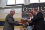 Gail Maholick/TIMES NEWS Terry McLean, architect, left, accepts a plaque from the Rev. Marshall Wolverton, right, pastor of Lighthouse Baptist Church, 1349 Green St., Franklin Township. Assisting with the presentation of plaques to people who helped…