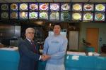 JOE PLASKO/TIMES NEWS Tony Lin (right), owner of China City in the Village Centre Mall, Snyders, is welcomed to West Penn Township by Supervisor Alfonso Martinez.