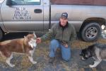 JOE PLASKO/TIMES NEWS Brad MacMillan, owner of Ma-Luk Sled Dogs Advertures, gives a snack to Huskies Klein (left) and Klondike (right) during the Fifth Annual Octoberfest held by the Pocono Mountain Leather Company at the Village Centre Mall in…