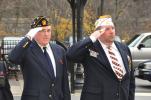 AMY ZUBEK/TIMES NEWS Martin Golden, Sgt. at Arms for American Legion Post 304 in Jim Thorpe; and Gilbert Henry, member of American Legion Post 304 and VFW Post 294 in Albrightsville, salute the American flag during Carbon County's Veterans Day…