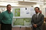 CHRIS PARKER/TIMES NEWS Green Energy Capital Partners executive director John F. Curtis III, left, and project manager David G. Lear of Lehigh Engineering Associates, flank plans for a 134-acre solar park to be built in Nesquehoning.