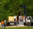 FILE PHOTO The bronze statue of Jim Thorpe is lowered onto a granite pedestal at the Jim Thorpe Memorial in the Borough of Jim Thorpe several years ago. A lawsuit threatens to remove Thorpe's remains to his family home in Oklahoma.