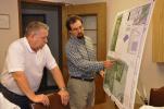 AMY ZUBEK/TIMES NEWS Project manager David G. Lear of Lehigh Engineering Associates, right, shows Ivan O. Meixell Jr., county planner, the plans for the proposed 134-acre solar park in Nesquehoning. The Carbon County Planning Commission yesterday,…