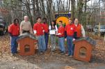 AMY ZUBEK/TIMES NEWS Five students of the Youth Services Agency of Pennsylvania in Jim Thorpe, dressed in red, receive a certificate of appreciation from Kimmy Mulik, vice president of Carbon County Friends of Animals, center, for donating their…