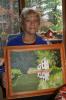 LINDA KOEHLER/TIMES NEWS PHOTOS Jean Perry holds her painting of the canal at Raubsville on the Delaware Canal.